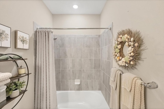 bathroom with shower / tub combo with curtain