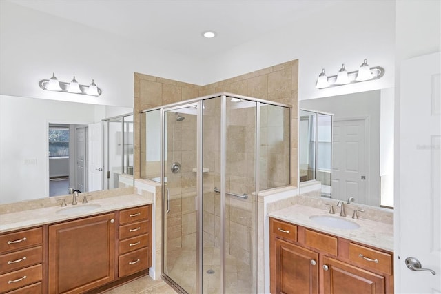 bathroom with vanity, tile patterned floors, and a shower with shower door