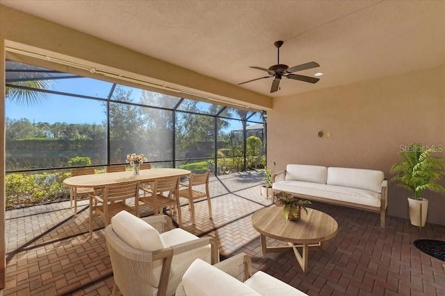 sunroom featuring ceiling fan