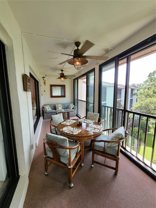 sunroom / solarium with ceiling fan and plenty of natural light