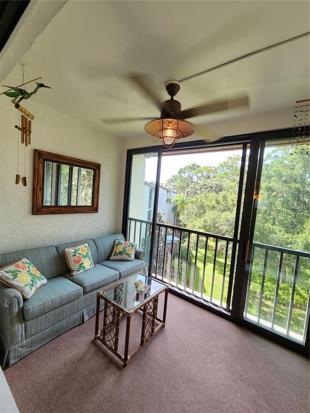 sunroom / solarium with a healthy amount of sunlight and ceiling fan