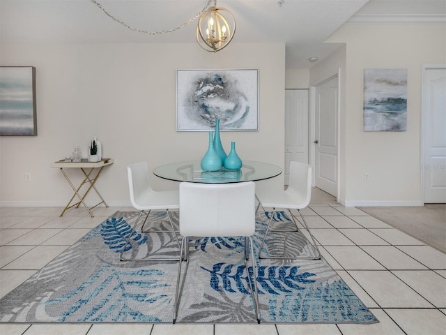 tiled dining room with a notable chandelier