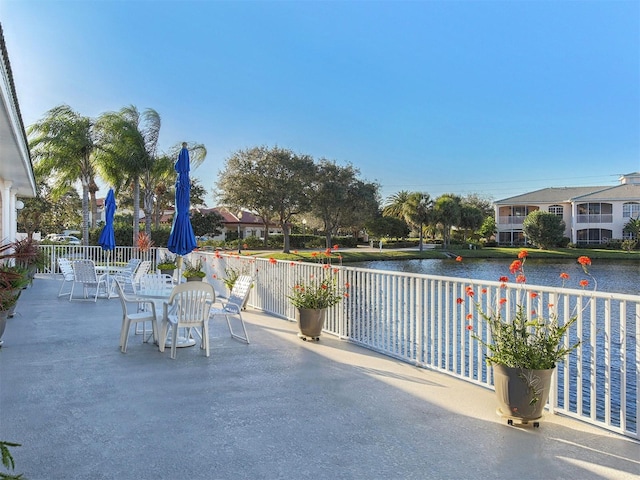 view of patio featuring a water view