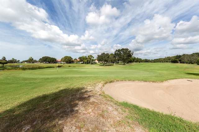 view of property's community featuring a lawn