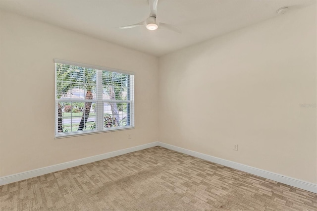 empty room with light carpet and ceiling fan