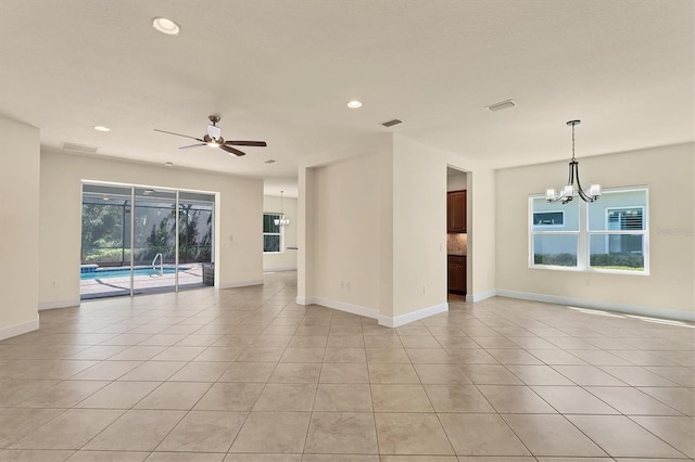 12273 Stuart Dr, Venice, FL 34293 - unfurnished room with ceiling fan with notable chandelier, visible vents, recessed lighting, and light tile patterned floors