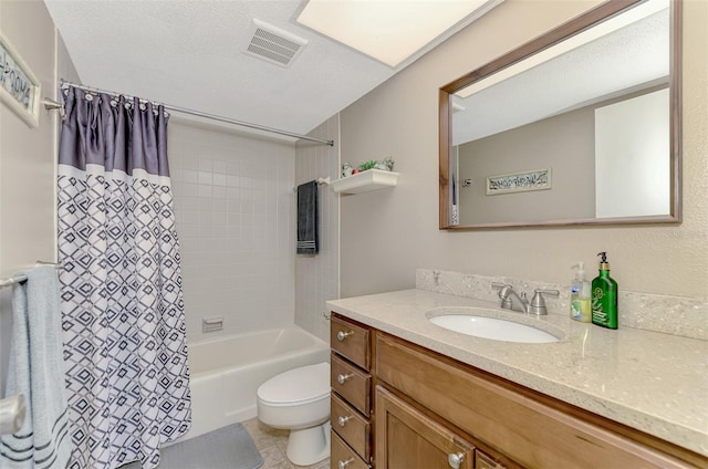 full bathroom featuring vanity, shower / bath combination with curtain, a textured ceiling, tile patterned flooring, and toilet