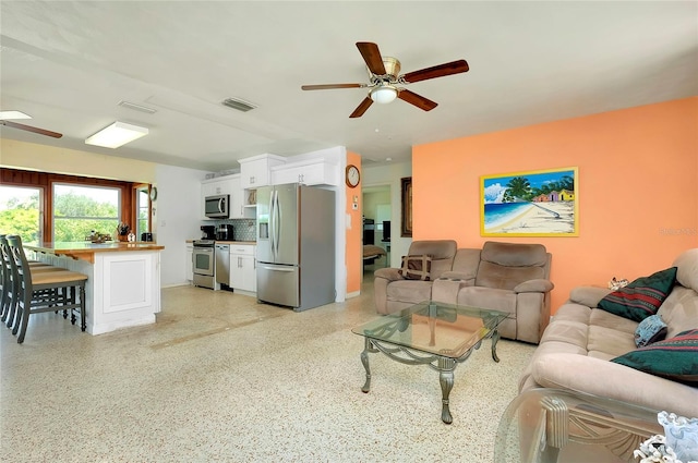 living room with ceiling fan