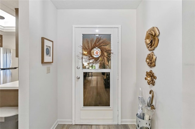 doorway with light hardwood / wood-style floors