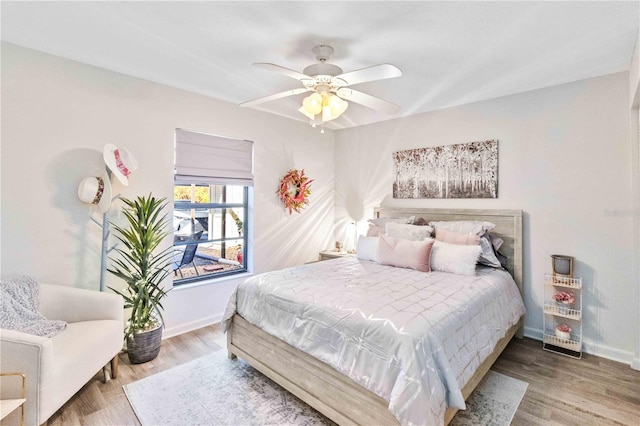 bedroom featuring hardwood / wood-style flooring and ceiling fan