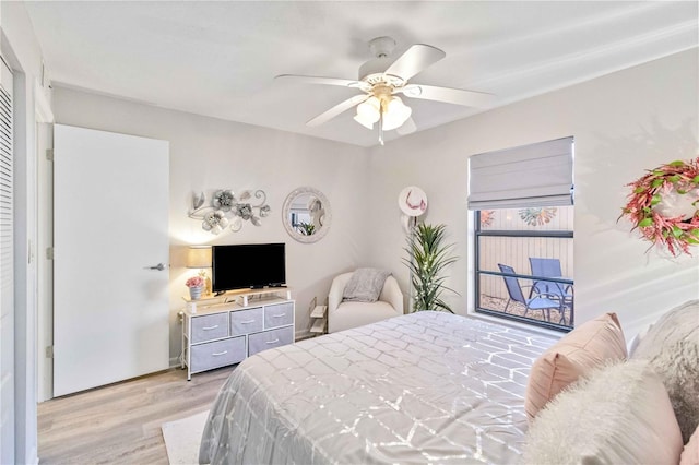 bedroom with light hardwood / wood-style floors and ceiling fan