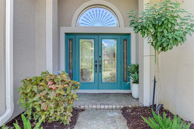 entrance to property featuring french doors