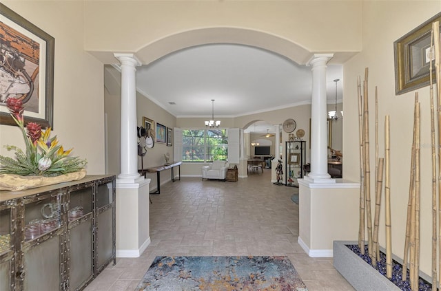 entrance foyer featuring a notable chandelier and ornamental molding