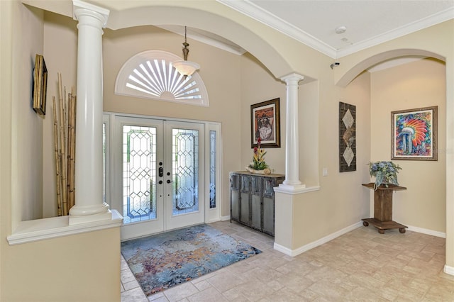 entrance foyer featuring crown molding and french doors