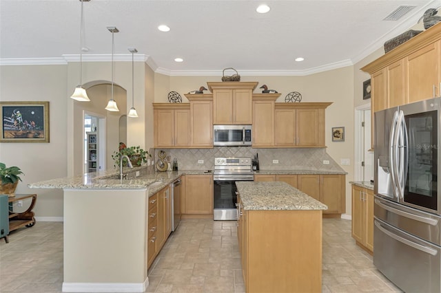 kitchen featuring hanging light fixtures, tasteful backsplash, light stone counters, kitchen peninsula, and appliances with stainless steel finishes