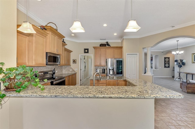 kitchen with backsplash, kitchen peninsula, ornate columns, and stainless steel appliances