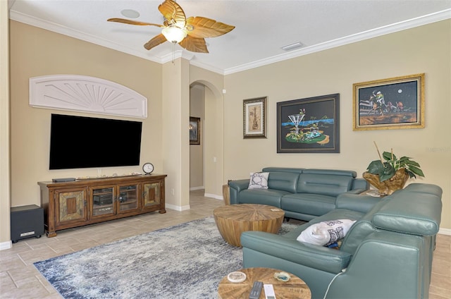 tiled living room featuring ceiling fan and crown molding