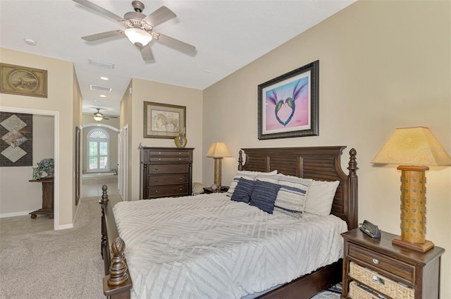 bedroom featuring light carpet and ceiling fan