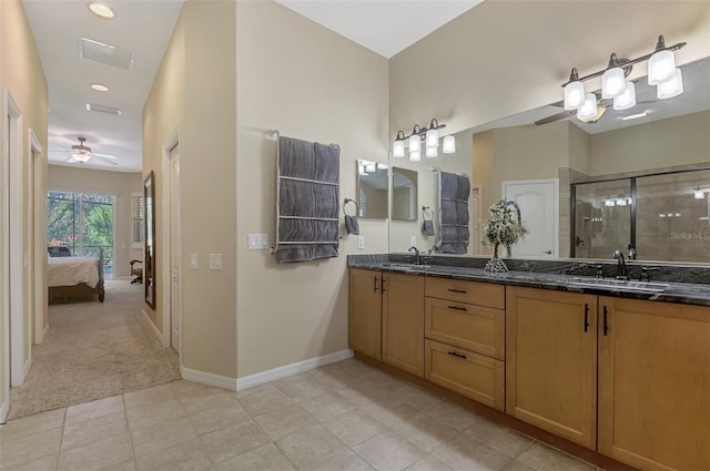 bathroom with tile patterned floors, vanity, ceiling fan, and an enclosed shower