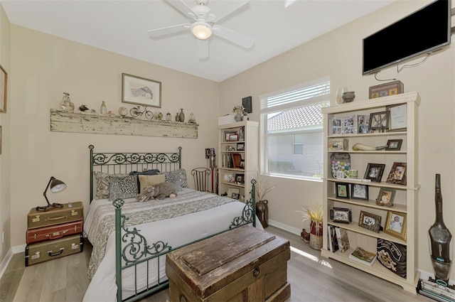 bedroom with ceiling fan and hardwood / wood-style floors