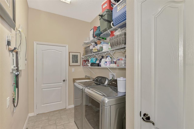 laundry area with washer and dryer and sink