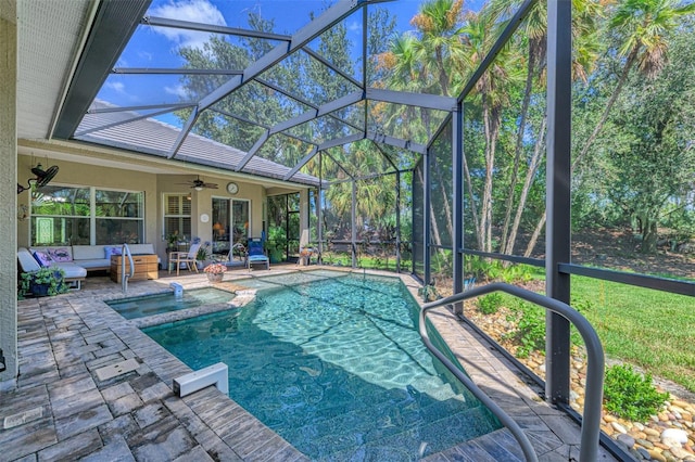 view of swimming pool featuring ceiling fan, a patio area, a lanai, and an outdoor hangout area