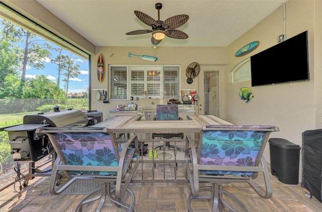 view of patio / terrace featuring ceiling fan and a grill