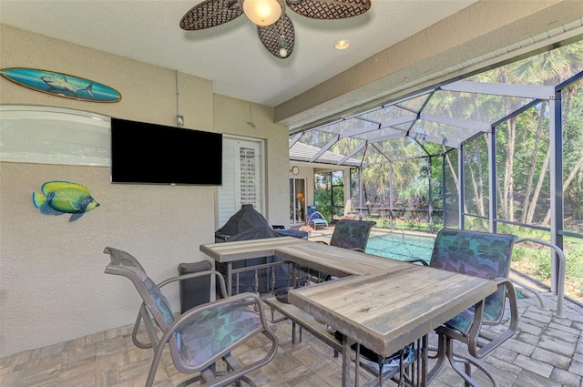 view of patio / terrace with a lanai and ceiling fan