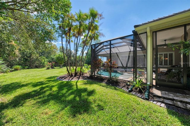 view of yard with a lanai