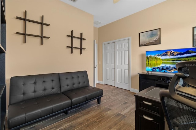 living room featuring dark wood-type flooring