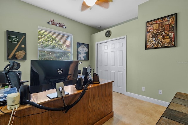 office space with light tile patterned floors and ceiling fan