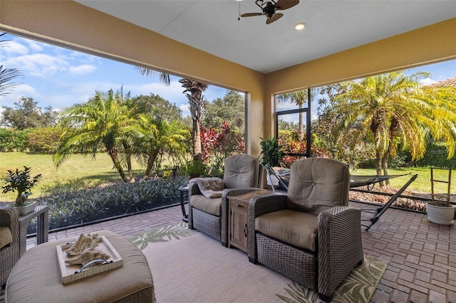 sunroom / solarium with ceiling fan