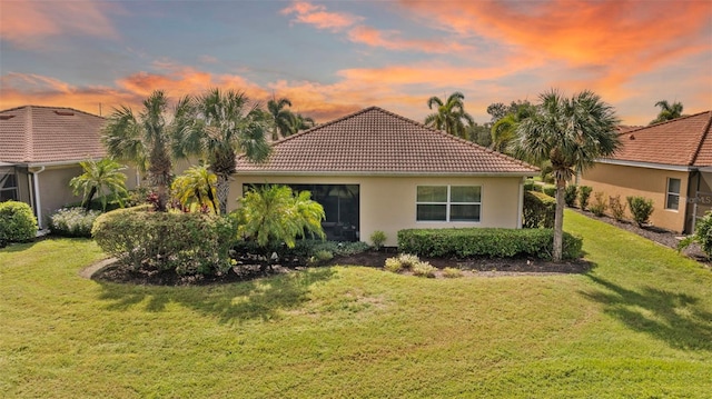 view of front of home featuring a yard