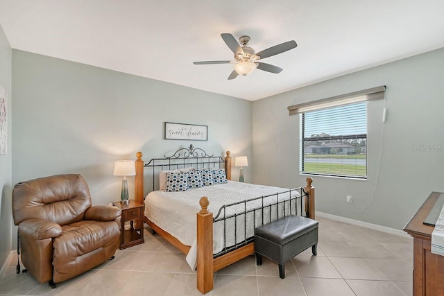 bedroom featuring light tile patterned floors and ceiling fan