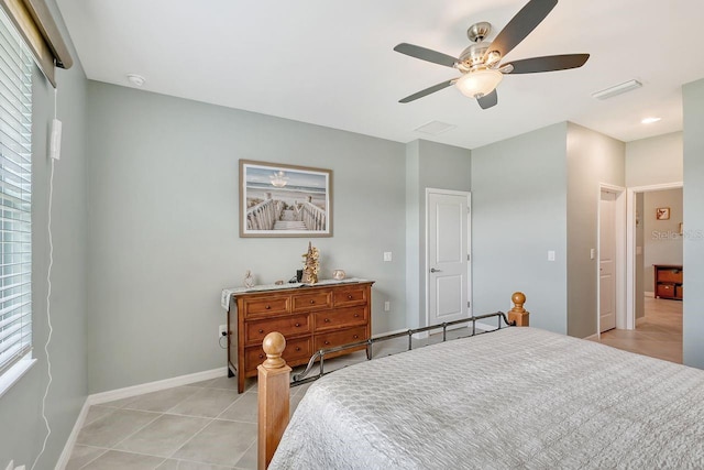 bedroom featuring light tile patterned floors and ceiling fan