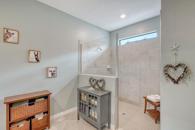 bathroom featuring a tile shower and tile patterned floors