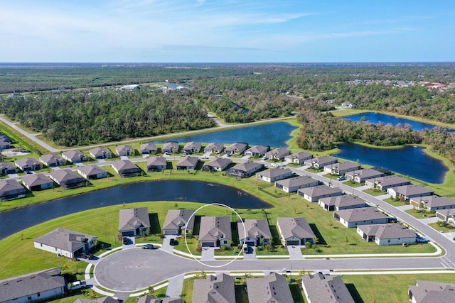 birds eye view of property with a water view