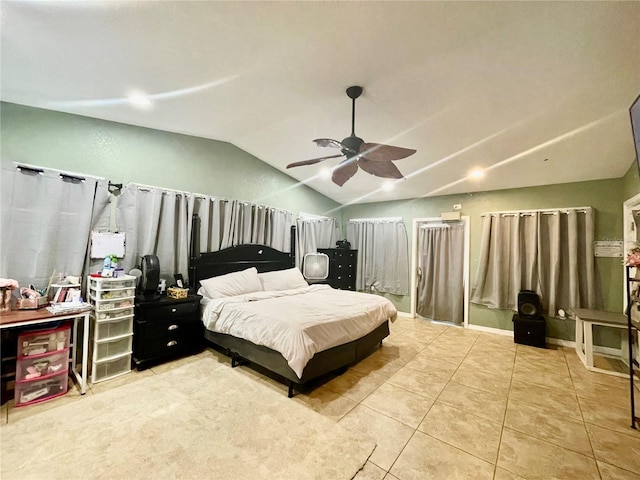 bedroom with tile patterned flooring, ceiling fan, and lofted ceiling