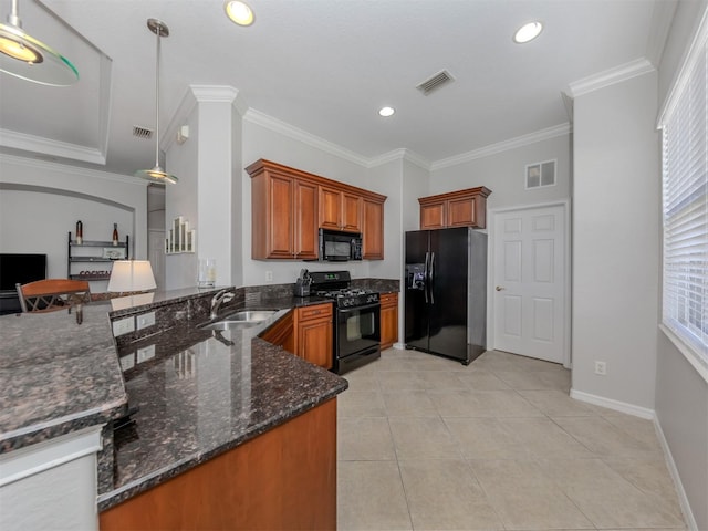 kitchen with black appliances, dark stone countertops, kitchen peninsula, crown molding, and decorative light fixtures