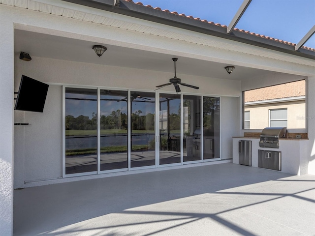 126 Cipriani Way N, Venice, FL 34275 - view of patio / terrace featuring an outdoor kitchen, a ceiling fan, glass enclosure, and area for grilling