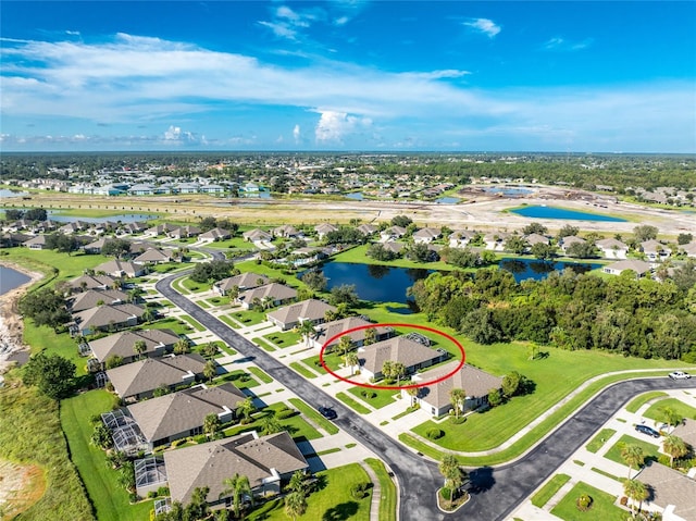 aerial view with a residential view and a water view