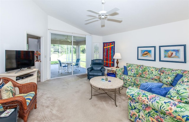 carpeted living room featuring ceiling fan and vaulted ceiling