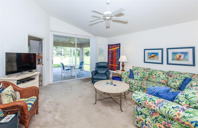 living room featuring ceiling fan, carpet, and lofted ceiling