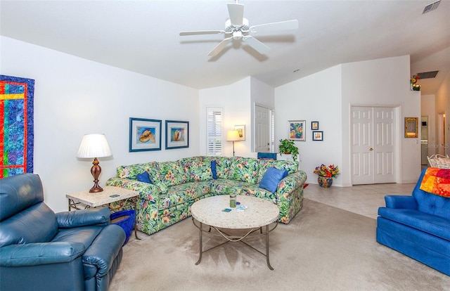 living room featuring ceiling fan, light colored carpet, and lofted ceiling