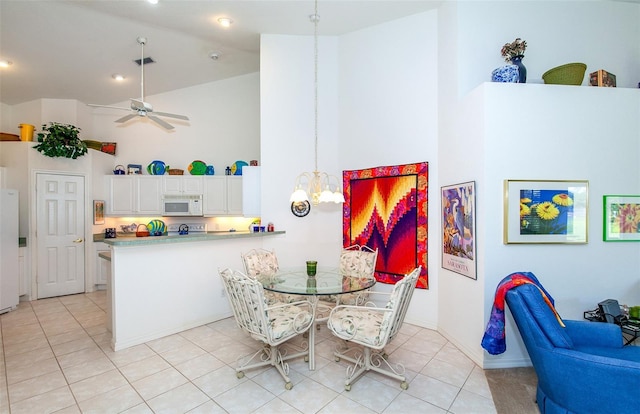 dining space featuring ceiling fan, visible vents, high vaulted ceiling, baseboards, and light tile patterned flooring