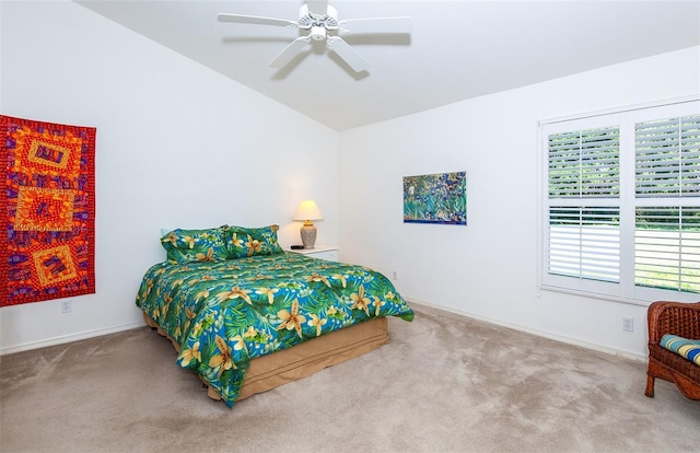 bedroom with carpet flooring, a ceiling fan, baseboards, and lofted ceiling