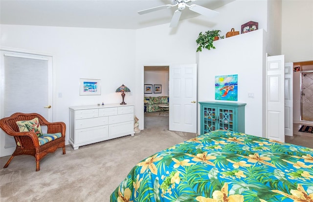 bedroom featuring lofted ceiling, ceiling fan, and light colored carpet