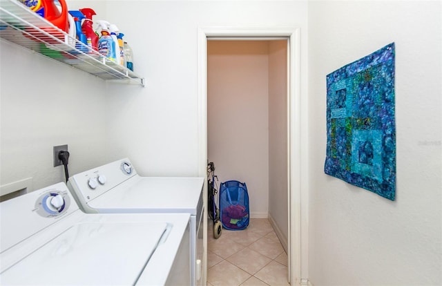 washroom with independent washer and dryer and light tile patterned flooring