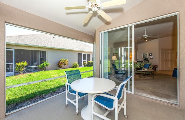 sunroom / solarium featuring vaulted ceiling