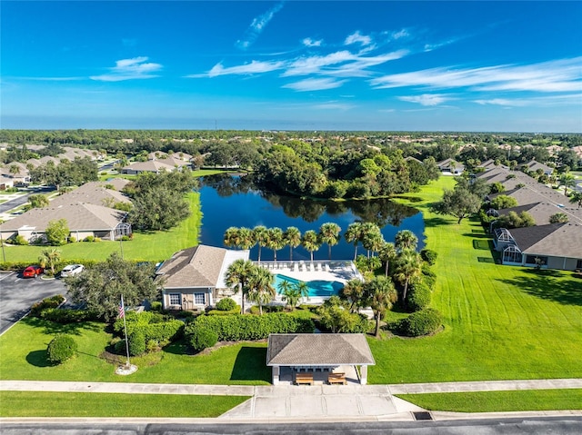 birds eye view of property featuring a water view and a residential view